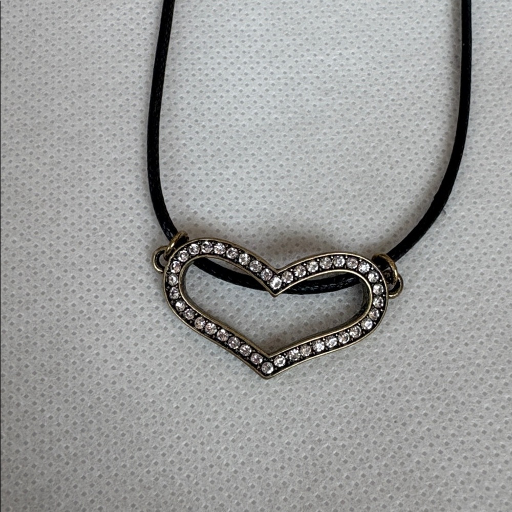 NWOT Cubic zirconia heart pendant on a black leather cord.